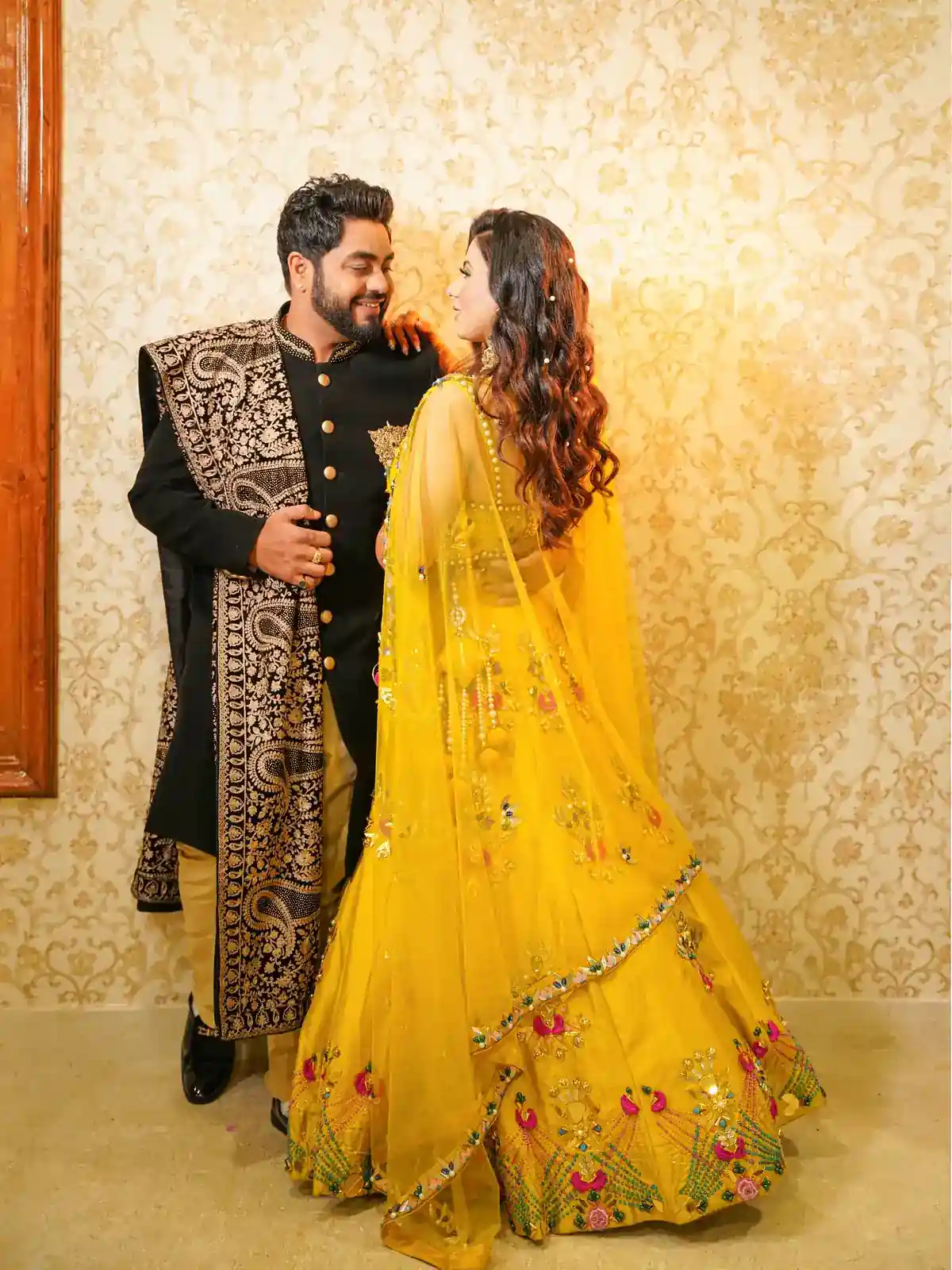 Engagement photoshoot couple posing in an elegant outdoor setting