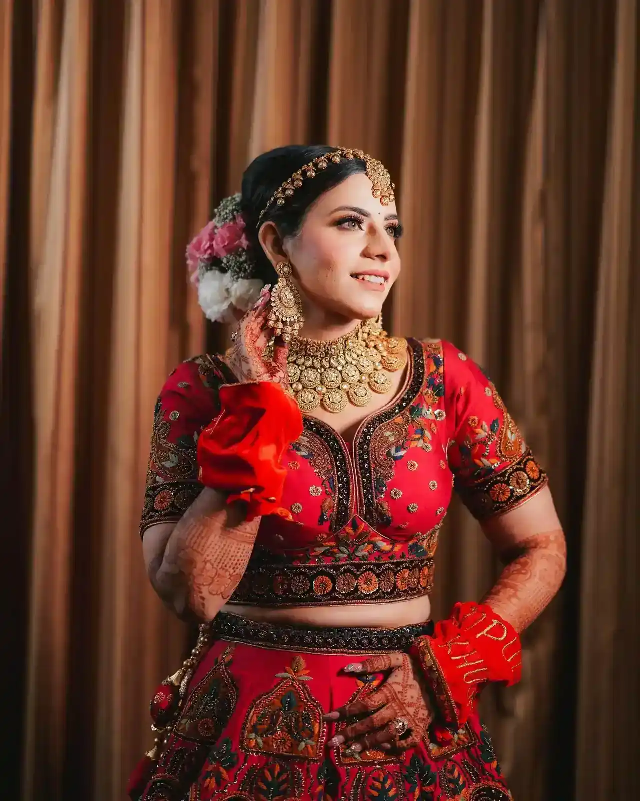 Indian bride portrait in red lehenga with professional wedding photoshoot