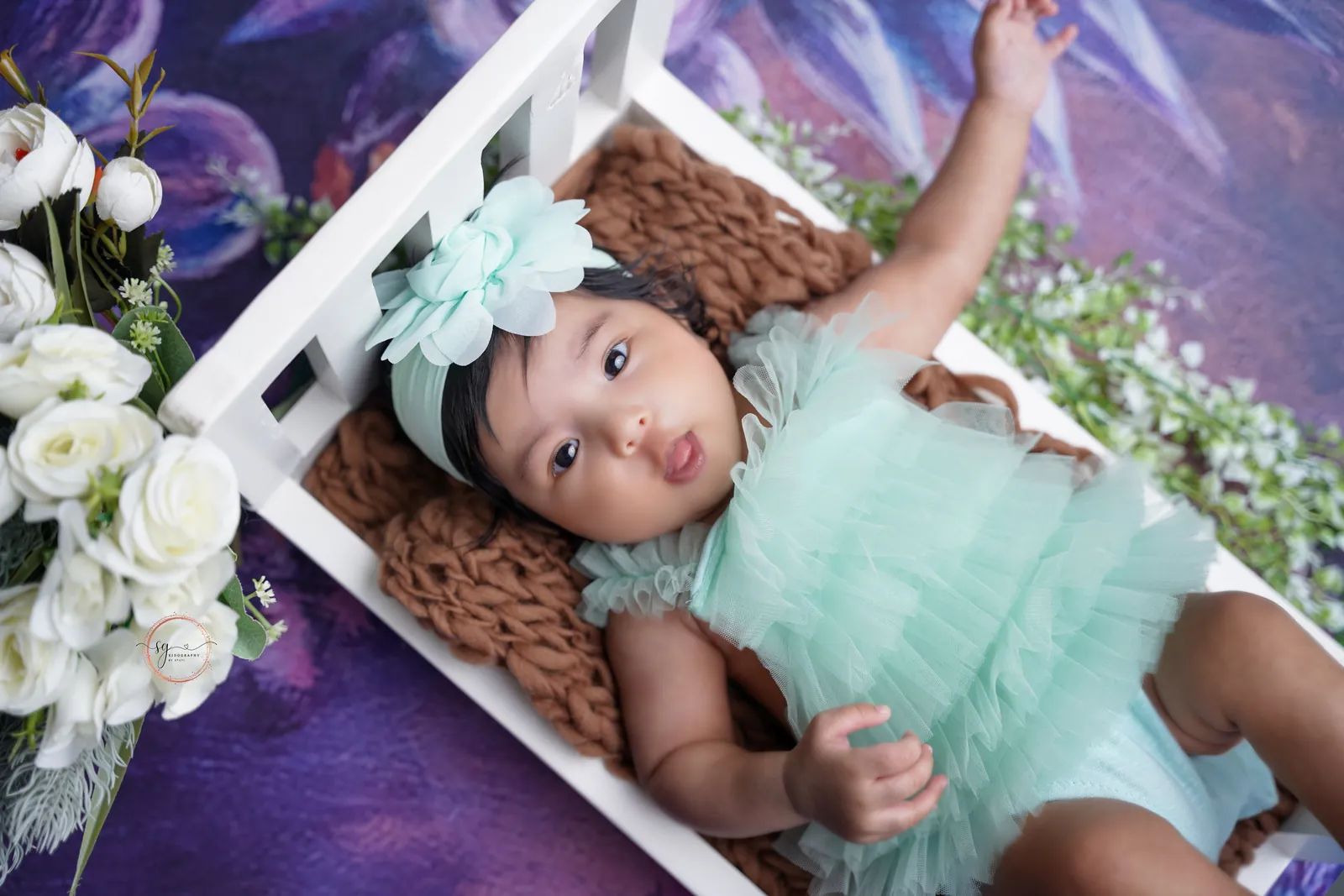 Cute newborn baby portrait captured during indoor photoshoot