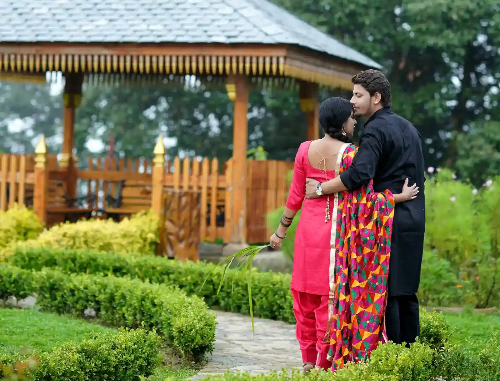 Cinematic pre-wedding photography with dramatic backdrop